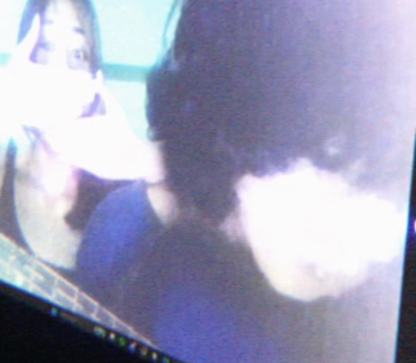 A dim photo of a monitor glowing in a dark room